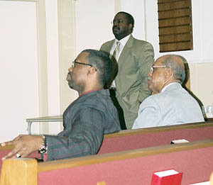 Pastor Palmer, Pastor Avery (standing) and Elder McKim